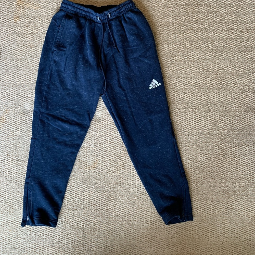 Adidas sweat pants.